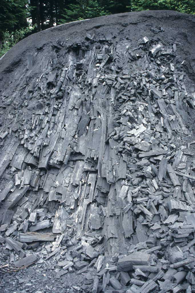 The charcoal producers extract up to six tons of barbecue charcoal from the burnt-out pile, between 1980 and 2005 © Paul Duss, Romoos