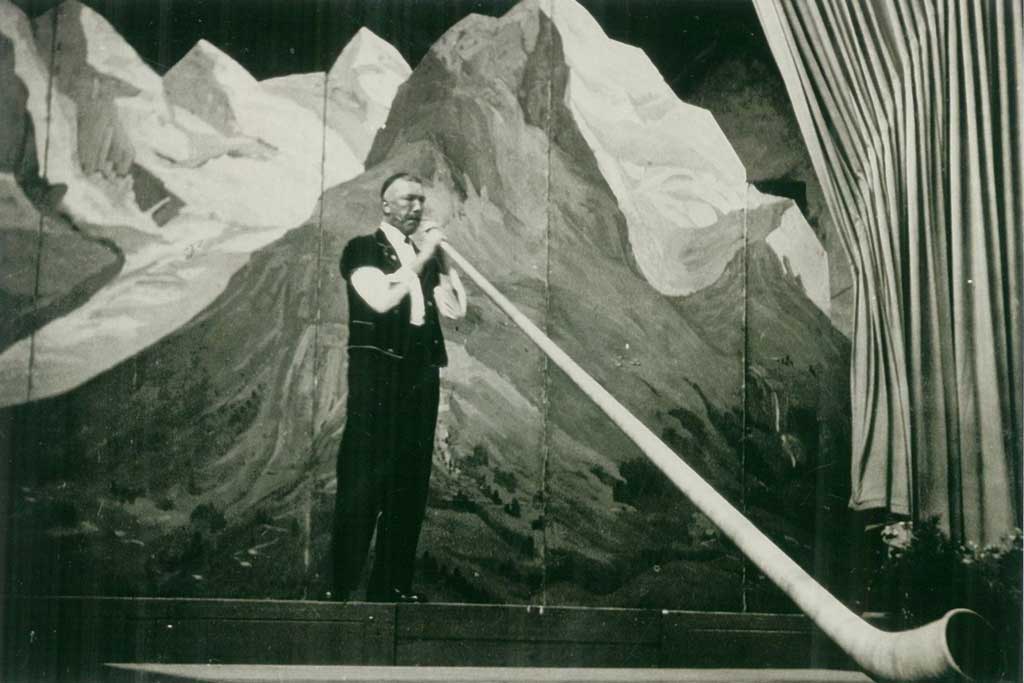 Alphorn player performing at the 1924 Swiss Yodelling Festival, Basel.