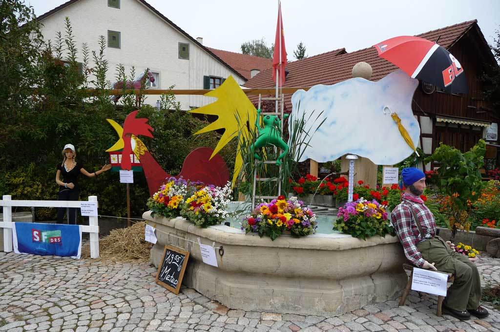 Village fountain decorated with a meteorological theme for the 2011 Hallau Autumn Sundays festival © Detlef Moll, Hallau, 2011